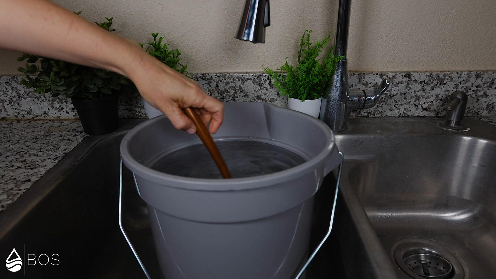 Stirring Water in Bucket to Distribute Impurities