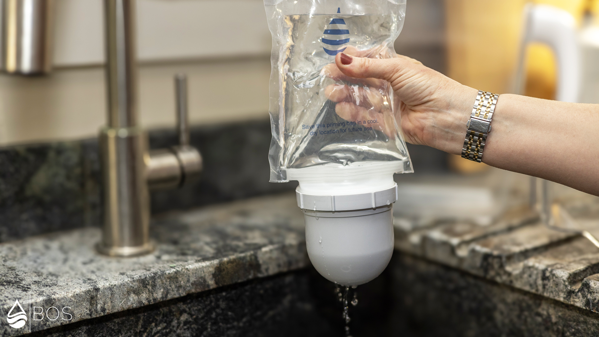 Clearly Filtered Water Pitcher Squeezing Water Through Priming Bag
