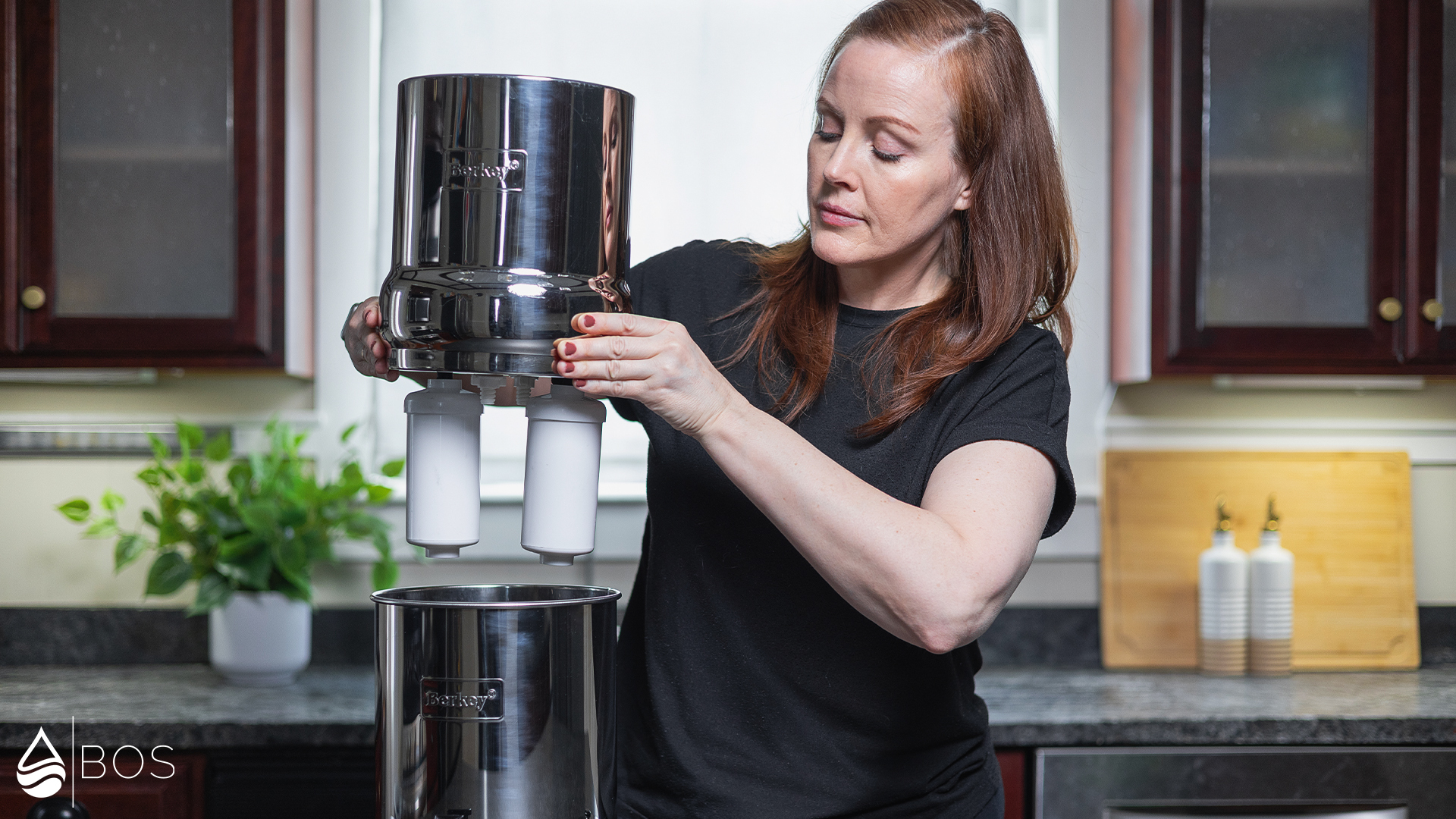 Big Berkey Placing Upper Tank with Fluoride Filters on Lower Tank